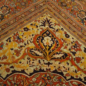 Ornate rug corner featuring large palmette motifs in rust, navy, and gold on a pale green ground.