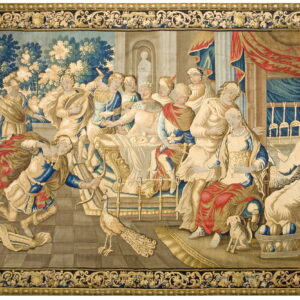 Large flat-woven tapestry depicting a classical banquet scene with figures, blue foliage, and an ornate gold and dark border.