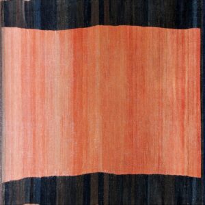 Close-up of a hallway runner rug with a horizontal coral band bordered by dark striped navy blue sections.