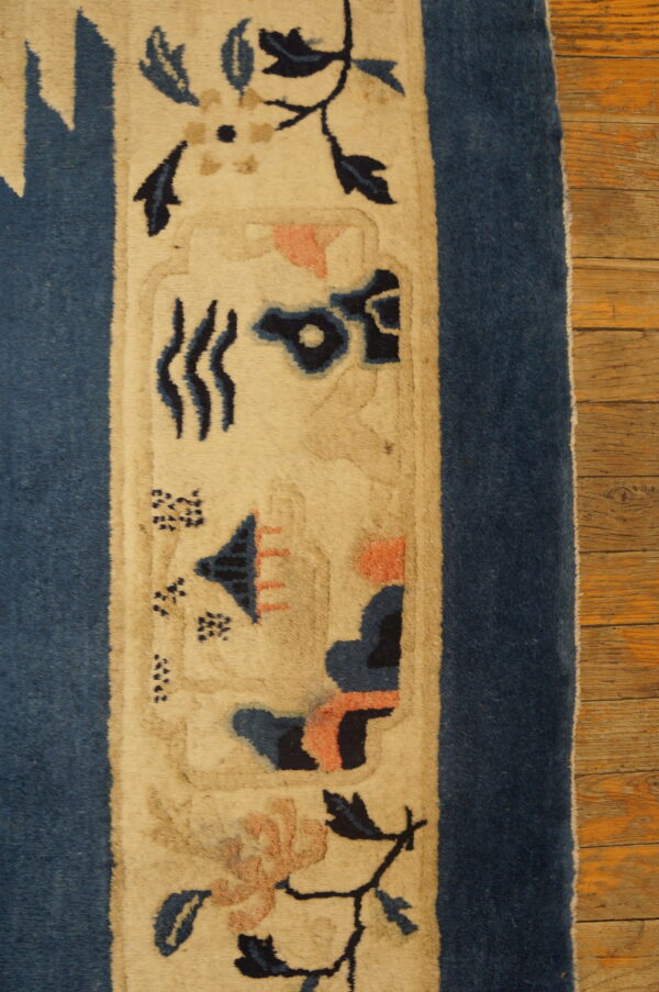 Decorative blue and cream patterned rug