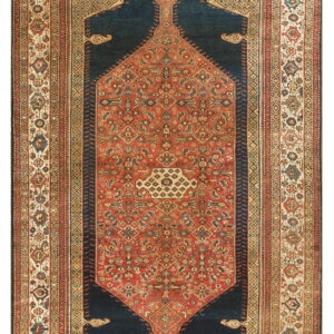 Traditional runner rug featuring a dark blue field surrounding a detailed red and tan stepped medallion.