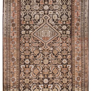 Long, dark brown runner rug with complex traditional floral patterns in contrasting beige, tan, and rust colors.
