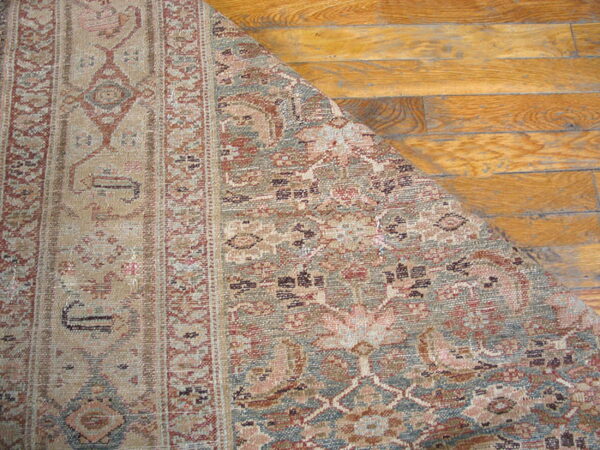 Intricate floral design on textured rug