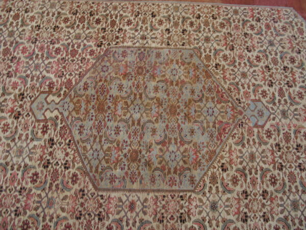 Intricate floral pattern on wool rug.