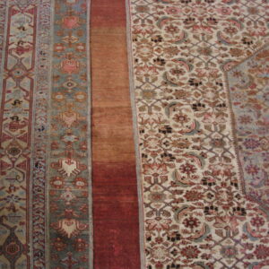 Intricate patterns on large wool rug