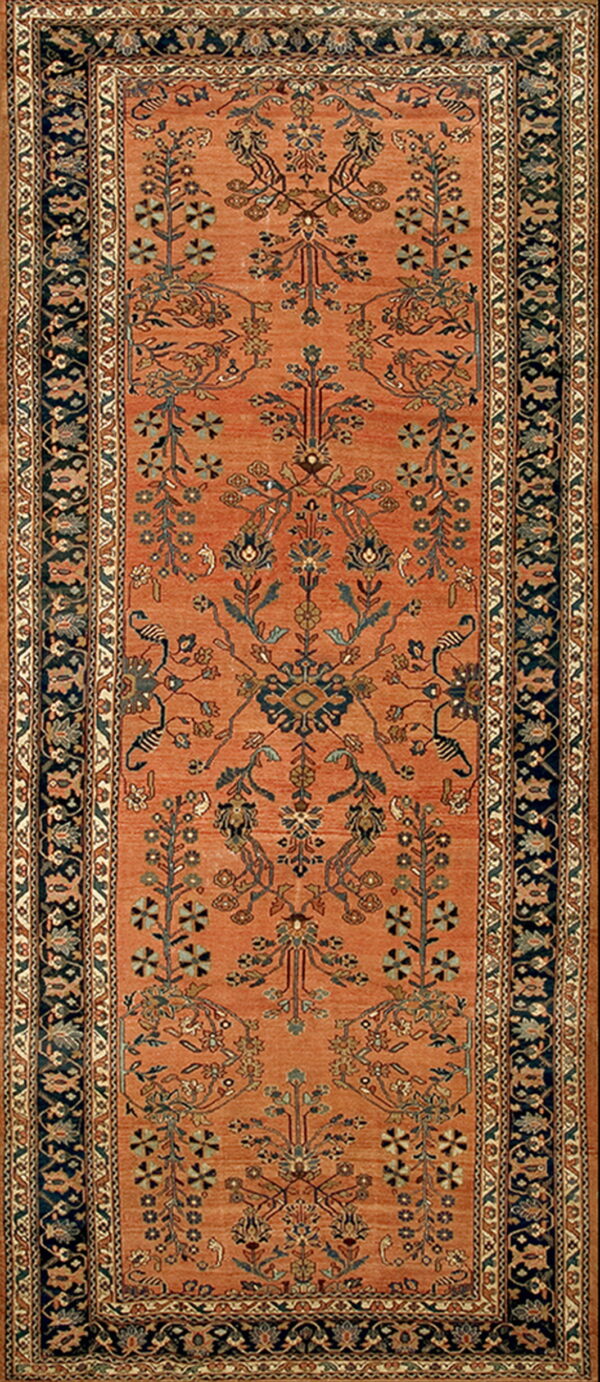 Terracotta runner rug with detailed blue, green, and tan floral motifs and a complex dark navy border.