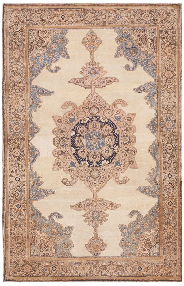 Traditional beige rug featuring an elaborate medallion, corner designs, and a border in blue and brown.