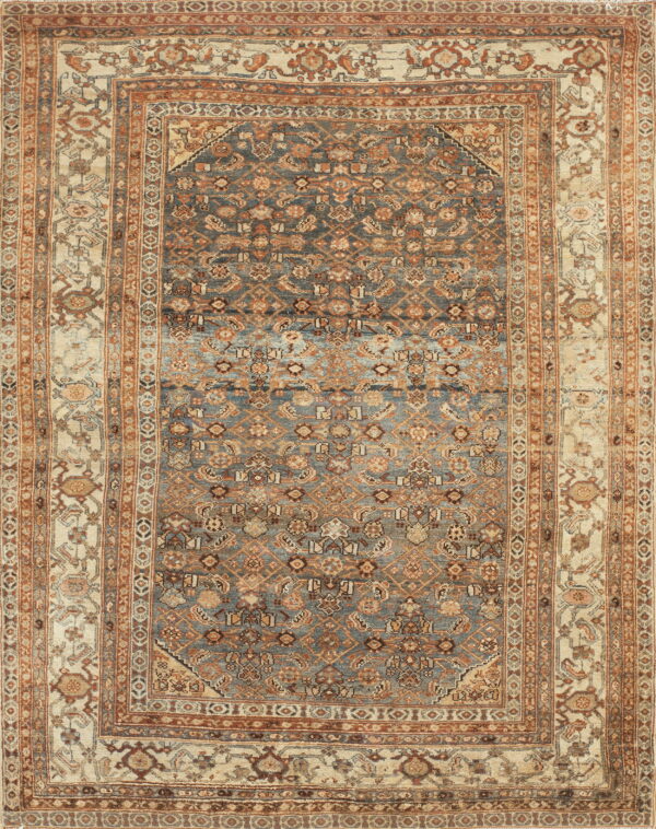 Full view of an ornate low-pile rug featuring a distressed blue field and intricate tan and rust multi-borders.