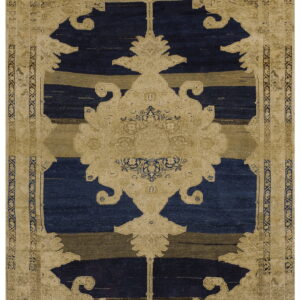 Tan and navy patterned rug featuring a stylized central medallion over horizontal striped color blocks.