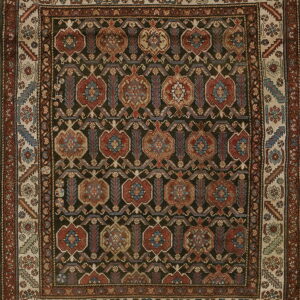 Traditional rug with a dark field, repeating red, blue, and beige medallions, and light patterned borders.