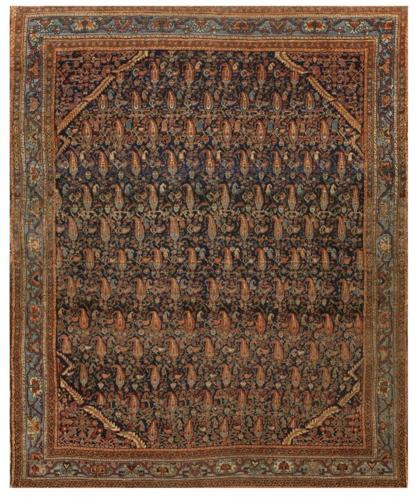 Navy blue rug with all-over rust and teal paisley pattern and wide multi-layered borders.