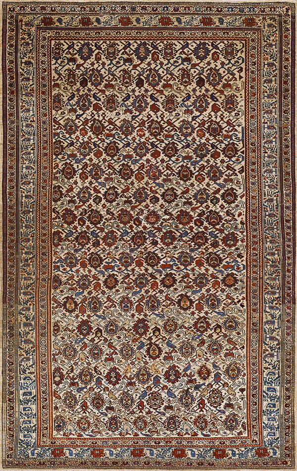 Rectangular rug with a cream field and dense traditional patterns in rust red and navy blue.