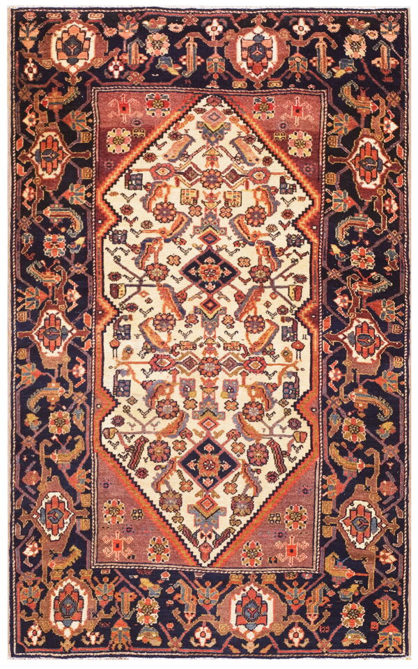 Traditional low-pile rug with stylized cream and navy geometric patterns, highlighted with rust and terracotta motifs.