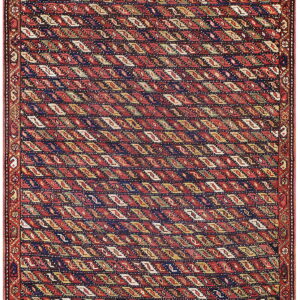 A rectangular rug with a red field patterned with repeating diagonal diamonds in navy, yellow, and white.