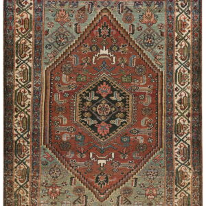 Stepped central medallion rug in deep rust, teal, cream, and black with dense geometric patterning.