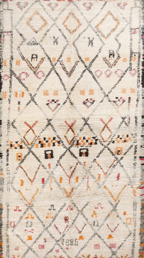 Cream high-pile rug featuring an irregular diamond lattice pattern and geometric motifs in black, orange, and pink.