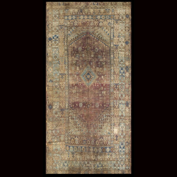 Geometric traditional rug with a stepped aubergine field, central diamond, and complex blue and beige borders.