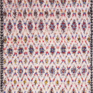 High-pile rug with a cream field, multicolored abstract trellis pattern, and a textured dark border.