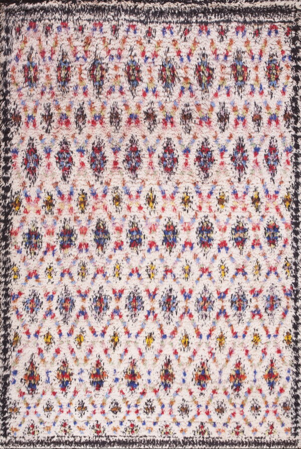 High-pile rug with a cream field, multicolored abstract trellis pattern, and a textured dark border.