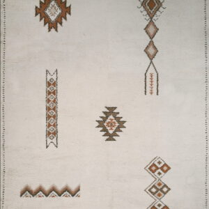 High-pile cream rug featuring scattered geometric patterns in brown, rust, and gray accents.