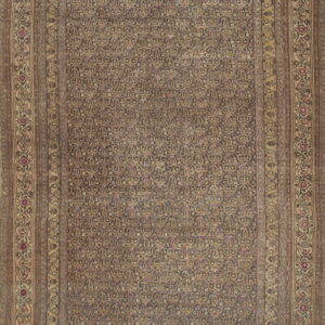 Low pile rectangular rug with a dense all-over floral pattern in muted earth tones, framed by wide borders.