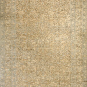 Traditional rug with a dense botanical pattern in tan, light gold, and pale blue colors.