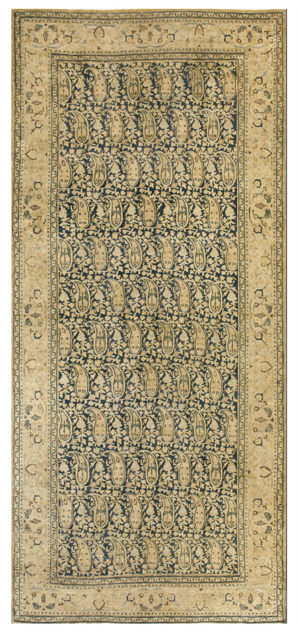 Navy blue rug with beige vertical paisley motifs and a wide, ornate tan border design.