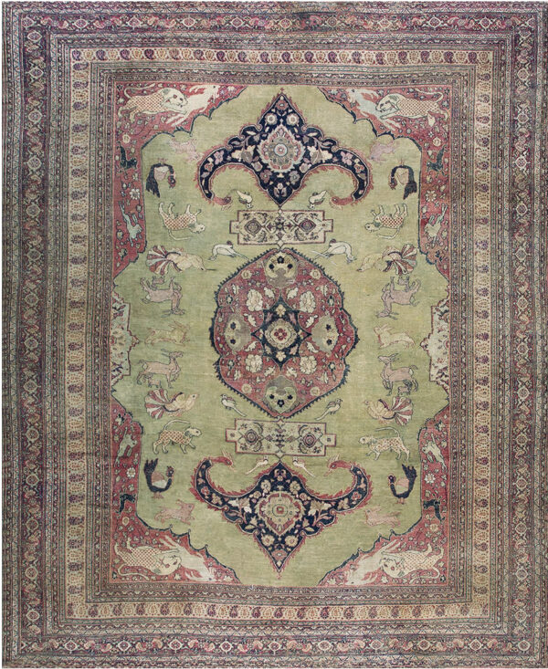 Pale green rug with rose, navy, and beige colors, featuring a central medallion and various animal figures.