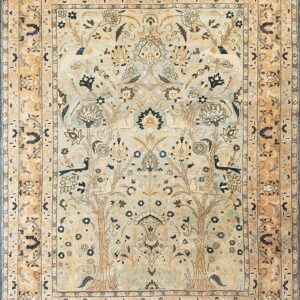 Pale blue and tan oriental rug with a Tree of Life design and dark floral accents.