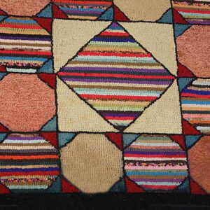 A close-up of a high-pile geometric rug with multicolored striped and solid brown octagonal blocks.