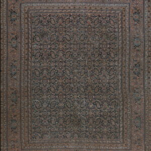A distressed, dark traditional rug featuring intricate floral patterns in muted browns and deep blues.