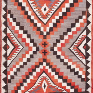 Flatweave rug with a geometric pattern in orange, gray, white, and brown featuring a large serrated central diamond.