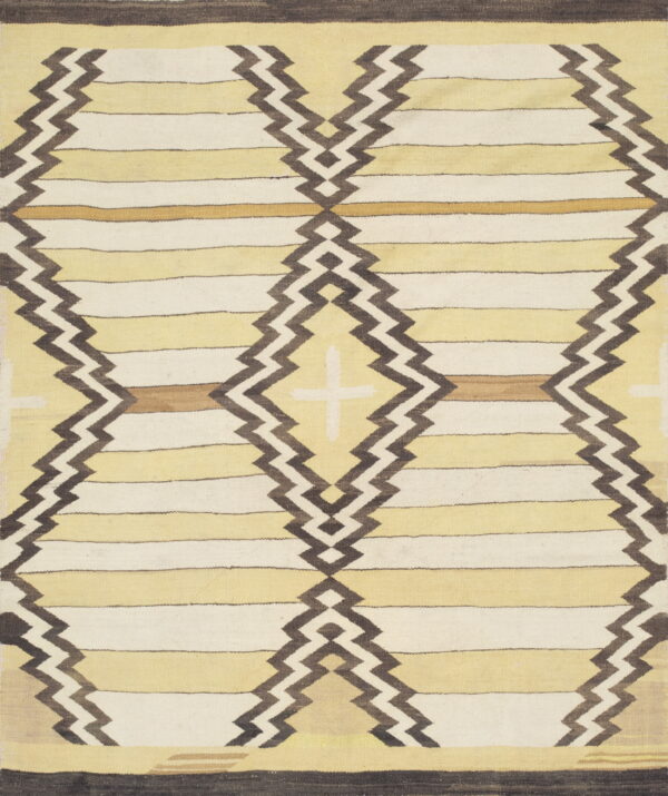 Cream and pale yellow striped flatweave rug featuring dark brown zigzag diamond patterns and solid borders.