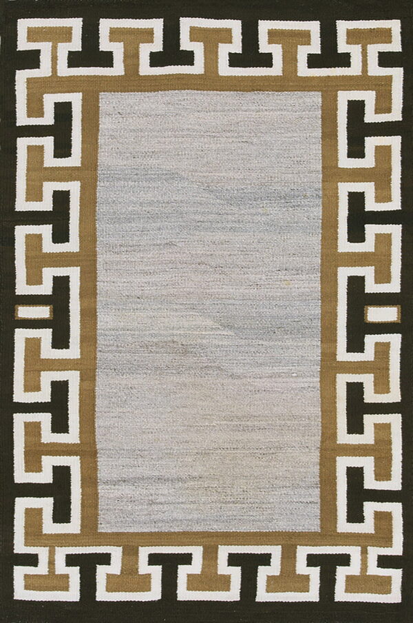 Low-texture rug with a mottled gray field and a bold brown, tan, and white geometric border.