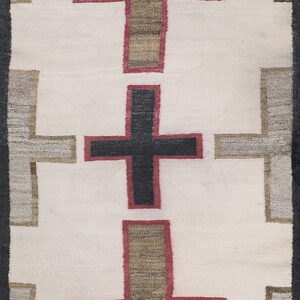 Off-white runner rug patterned with alternating black and earthy brown crosses outlined in dark rose and gray.