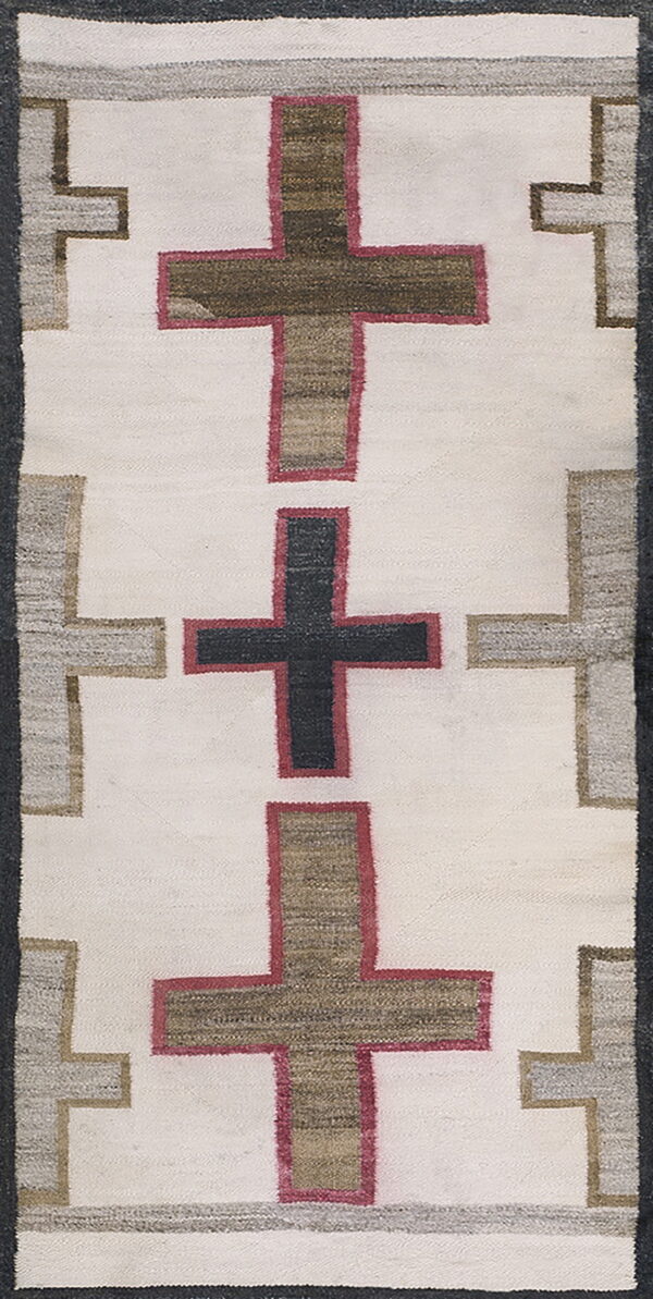 Off-white runner rug patterned with alternating black and earthy brown crosses outlined in dark rose and gray.