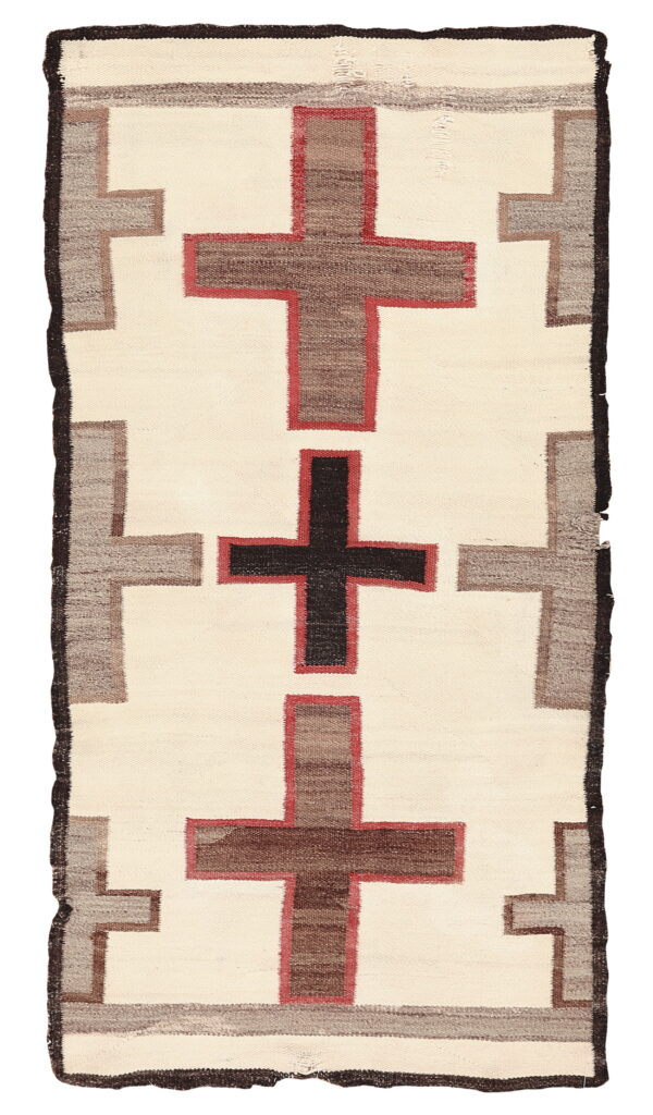 Cream flat-weave rug featuring large brown and black crosses framed by gray stepped borders.