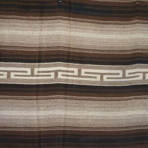 Brown, tan, and black striped flatweave rug centered with a continuous cream meander pattern.