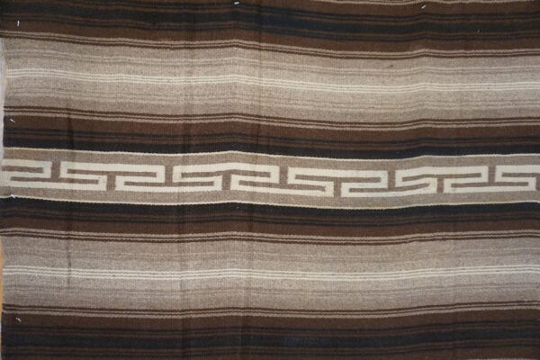 Brown, tan, and black striped flatweave rug centered with a continuous cream meander pattern.