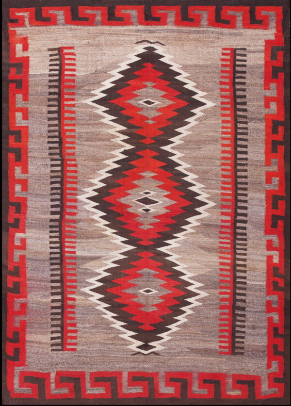 A flatwoven rug with a gray field, serrated red and brown diamonds, and a geometric key border.