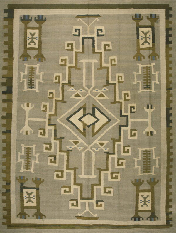 Flatweave rug with a central diamond and geometric figures in gray, olive, cream, and blue accents.