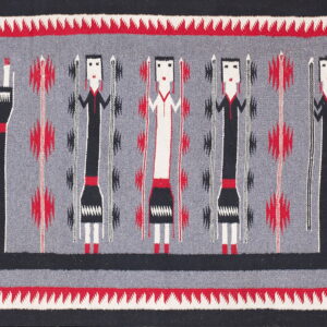Black, red, and gray woven rug with abstract figures and a serrated border design.