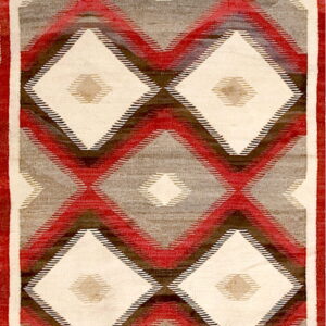 Geometric flatweave rug featuring repeating diamonds in cream, red, gray, and dark brown within a red border.