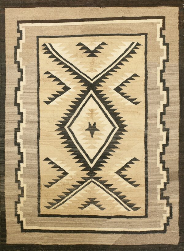 A flatweave rug featuring a central diamond and geometric pattern in beige, gray, and black.