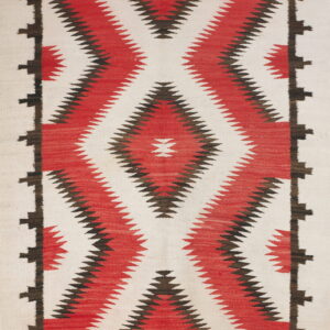 Vertical diamond pattern in red and dark brown on an off-white flatweave rug with a stepped border.
