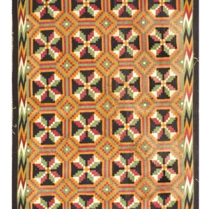 Black, orange, red, and green flatweave rug with repeating geometric squares and zigzag side borders.