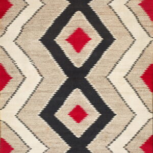 Flatwoven rug with serrated black, red, gray, and white geometric diamond designs.