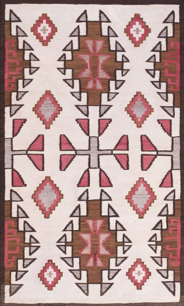Cream flatweave rug with repeating geometric designs in brown, gray, and bright pink.