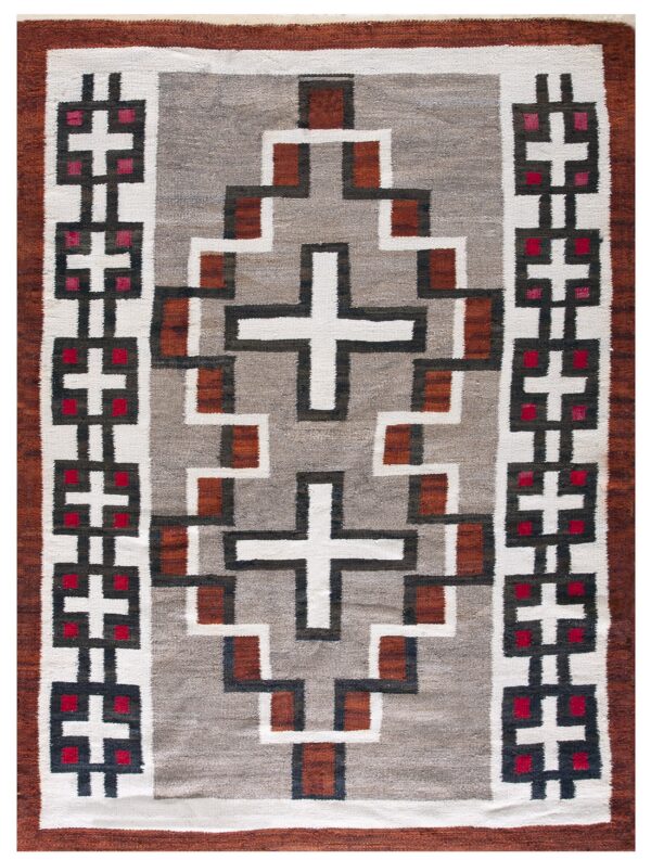 Flatweave rug with a heathered gray field, rust border, and geometric white, red, and dark brown patterns.