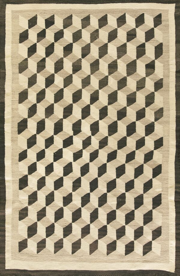 Flatweave rug displaying a geometric tumbling cube design in dark brown, tan, and off-white.